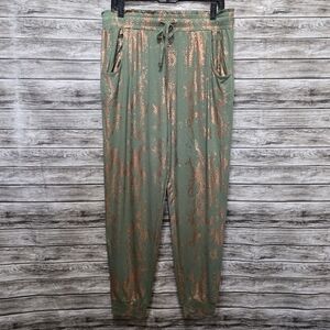 Modern butterfly green snakeskin joggers
